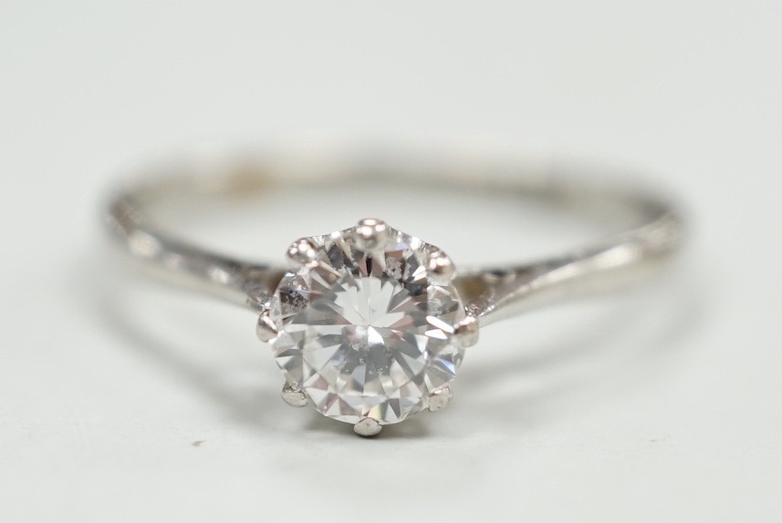 A white metal (stamped plat) and solitaire diamond ring, size P, gross weight 2.9 grams